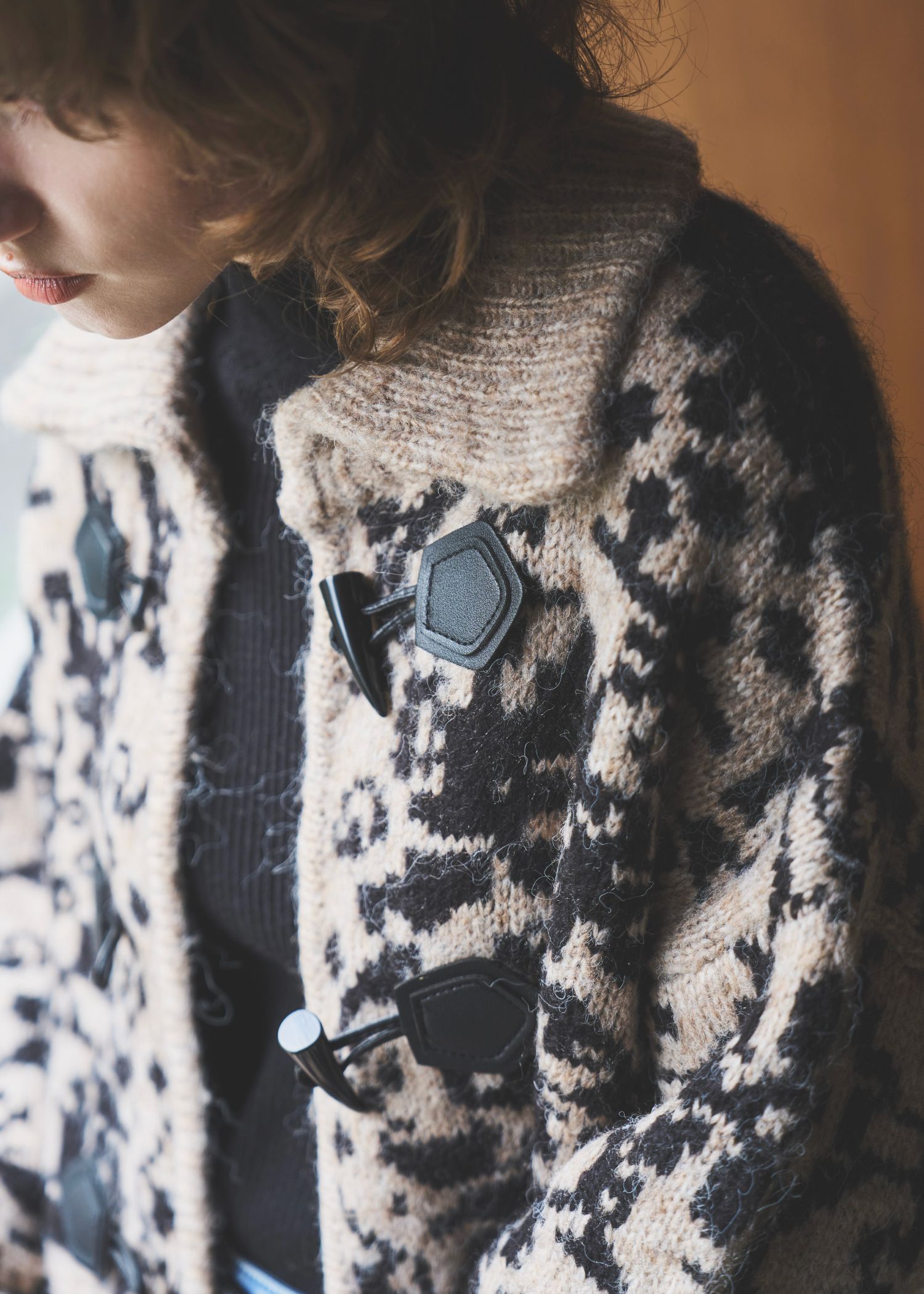 jacquard & cable placement toggle knit