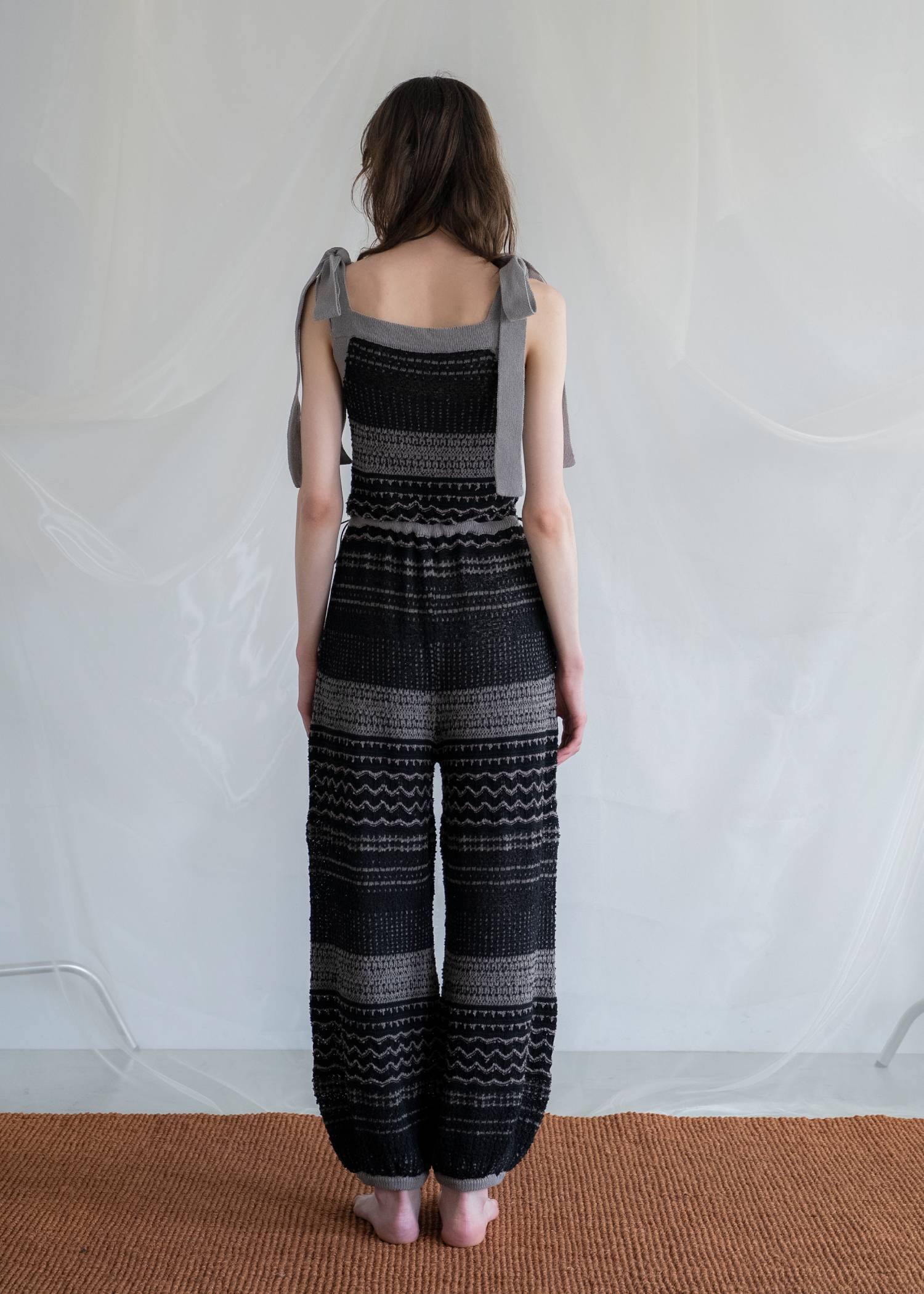 at random geometric pattern knit all-in-one