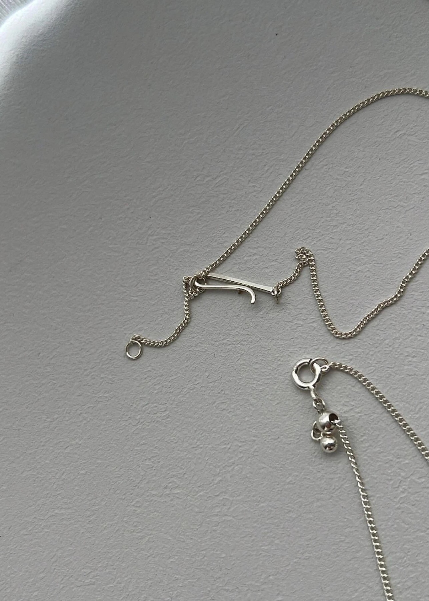 unstable initial motif bracelet