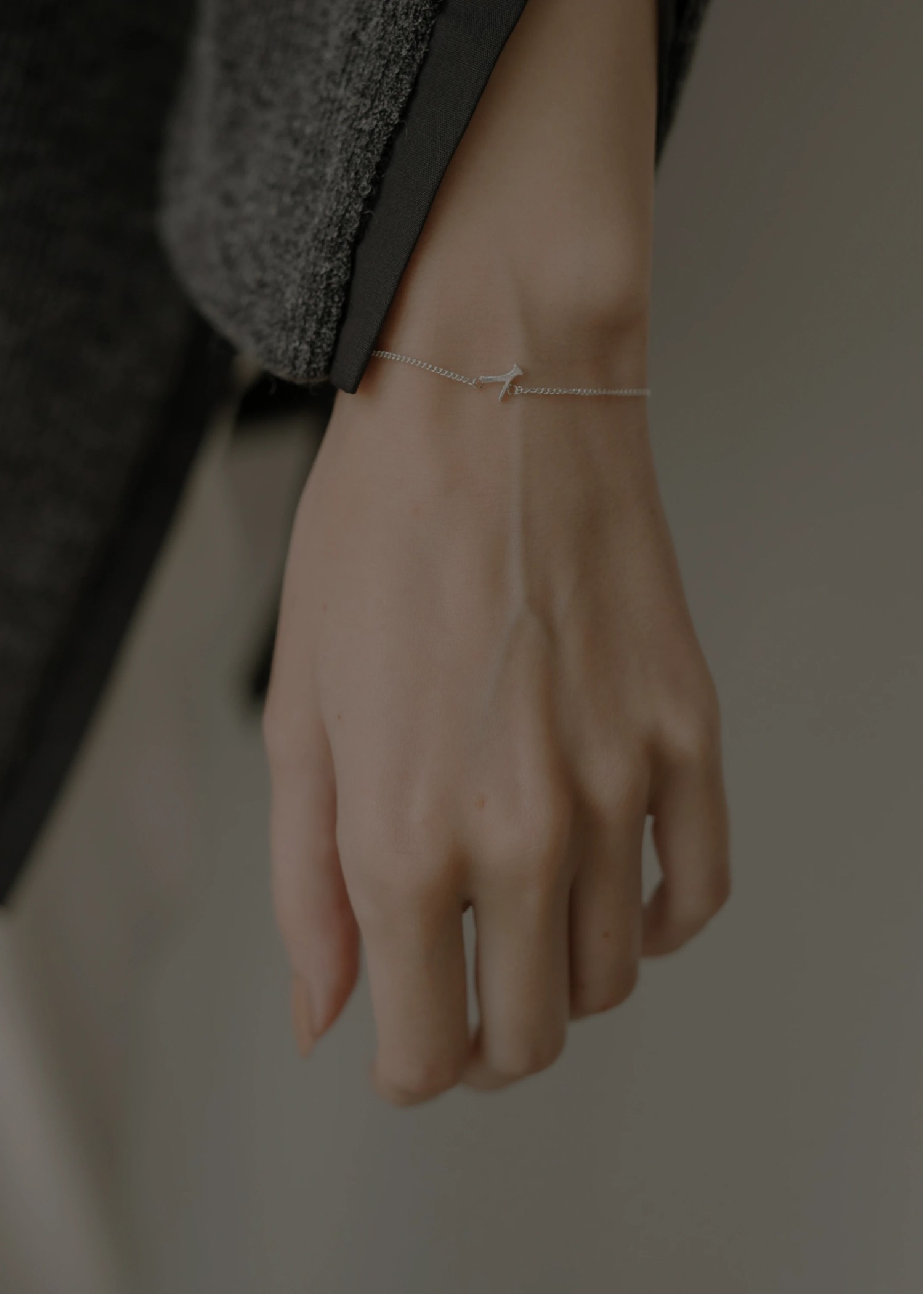 unstable initial motif bracelet