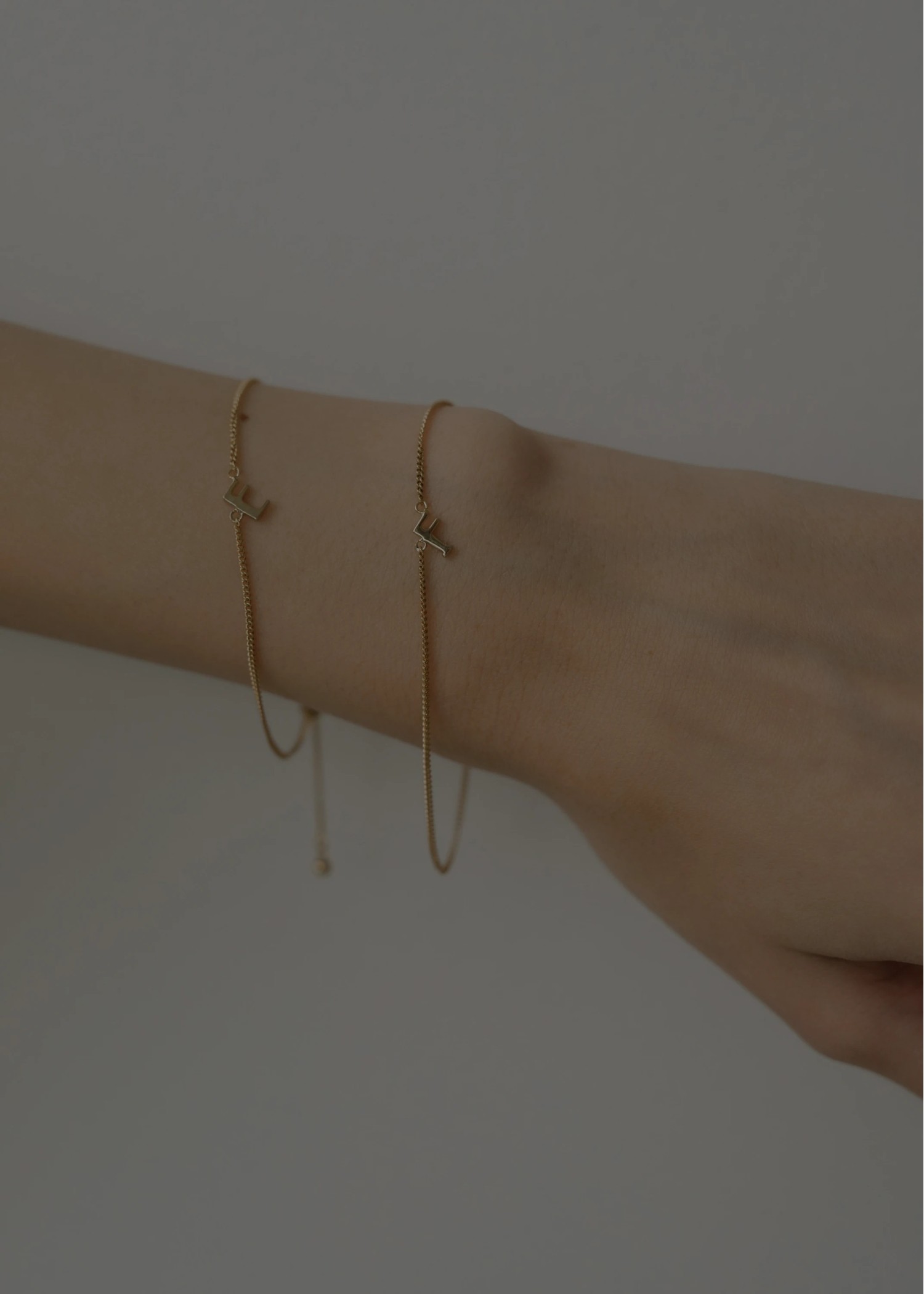 unstable initial motif bracelet