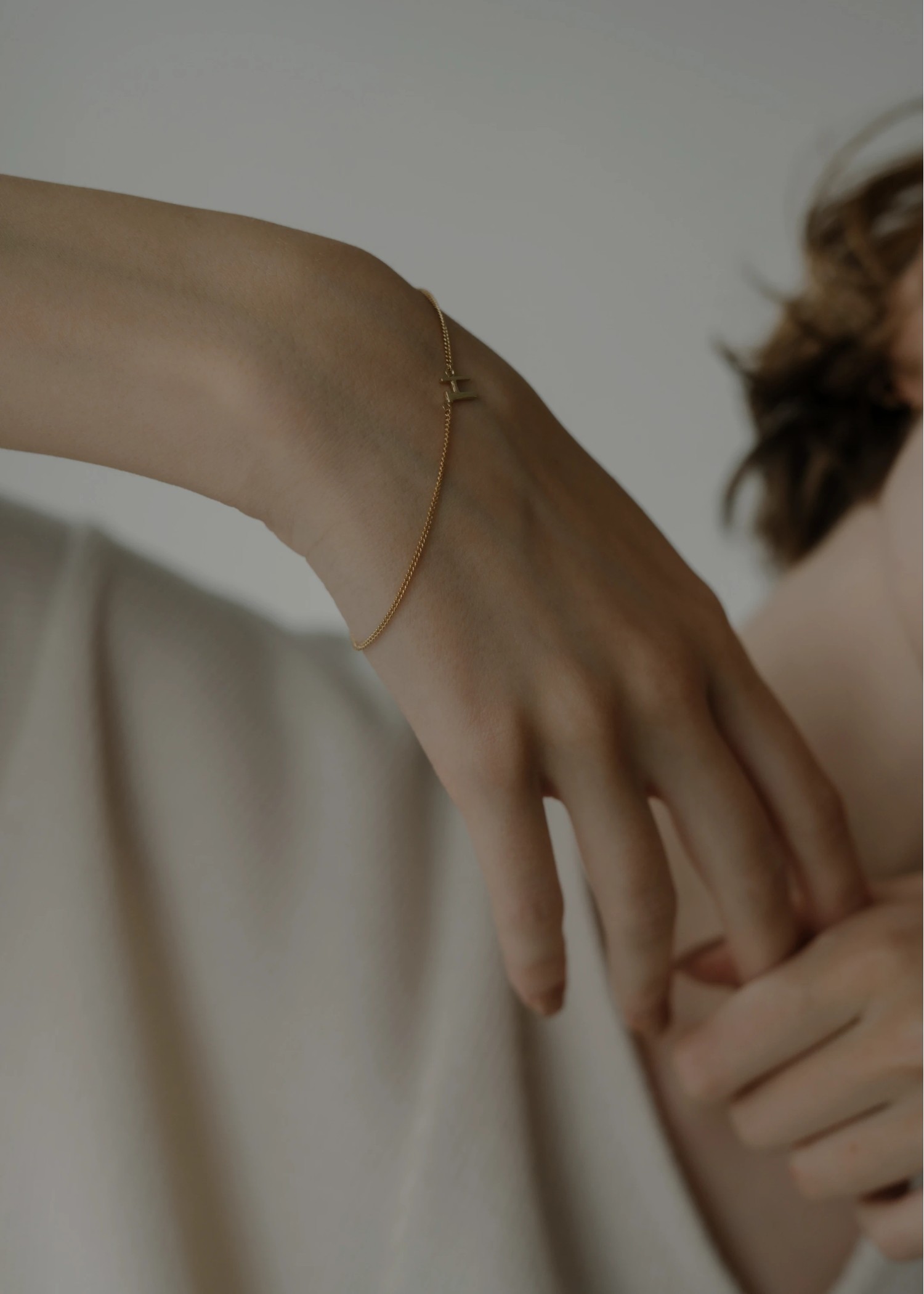 unstable initial motif bracelet