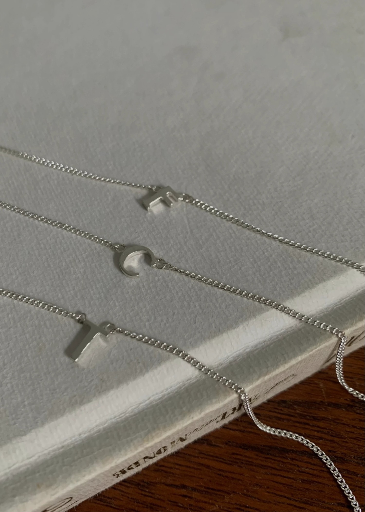 unstable initial motif bracelet