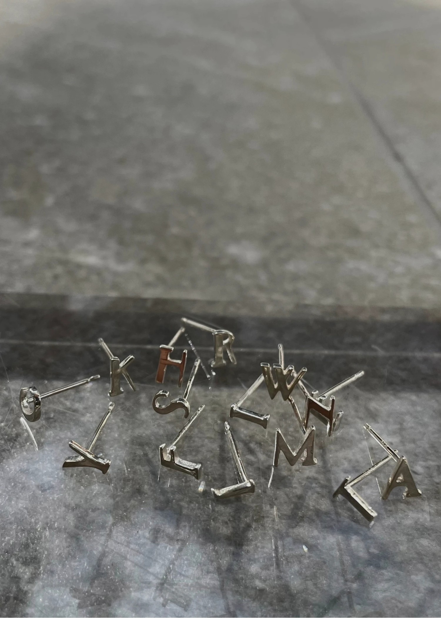 tiny bit initial motif pierce