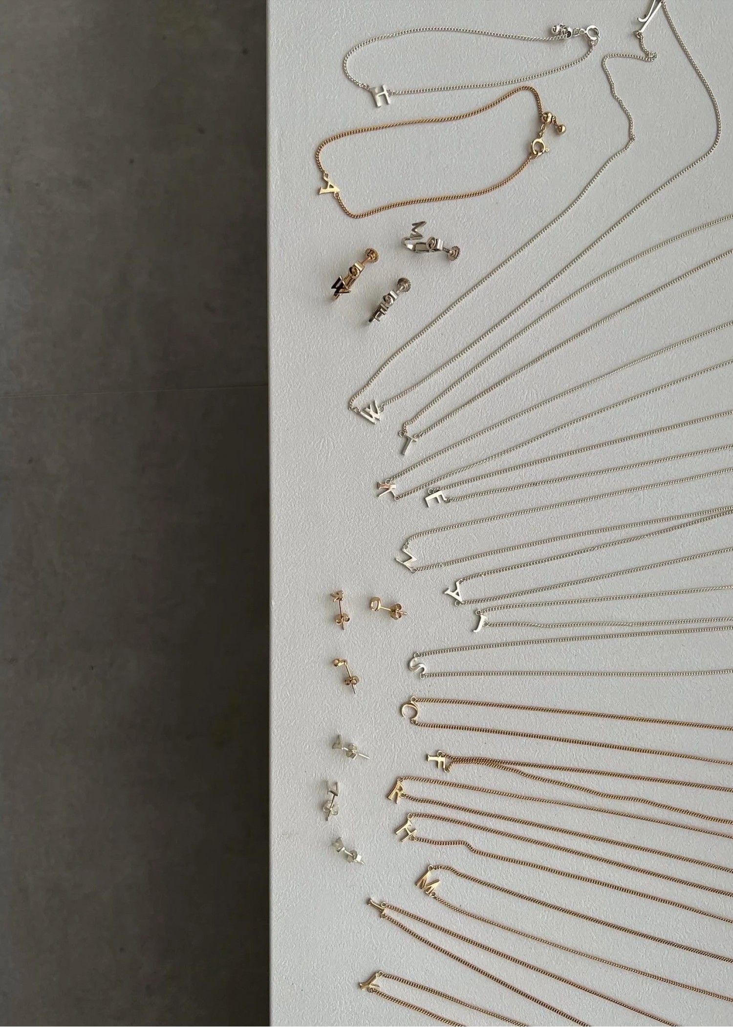 bit initial tiny motif earring